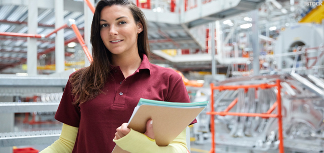 Supervisor holding files in car factory Supervisor holding files in car factory