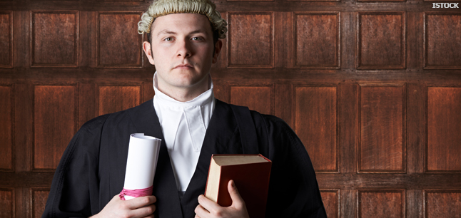 Solicitor in court holding brief and book