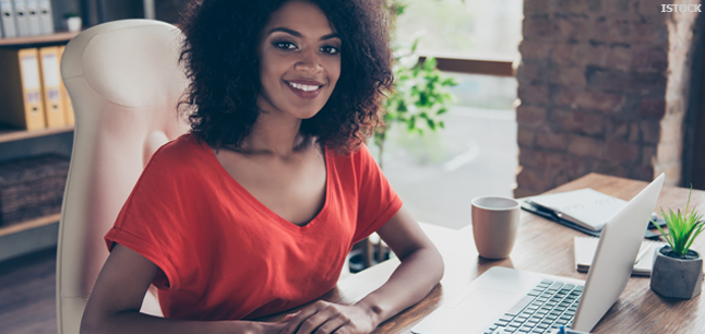 Administrator in office with computer files and office equipment Administrator in office with computer files and office equipment