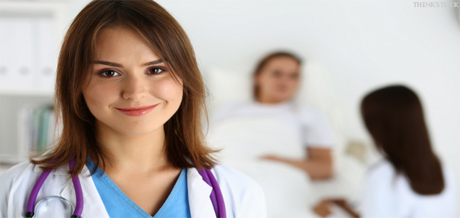 Female medicine doctor in front of patient in bed